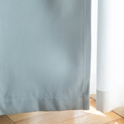 Close-up of Hayden custom blackout curtain fabric in soft blue-gray.