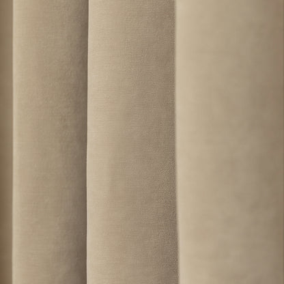 Bennett Chenille blackout curtain in light beige, showing plush texture and elegant draped folds.