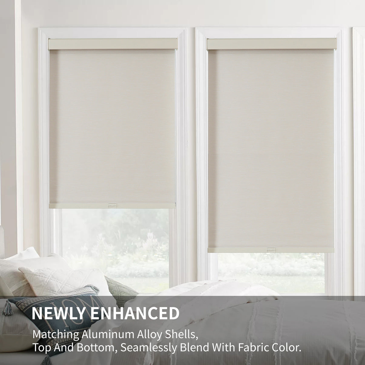 Beige cordless blackout roller shades with woven texture and matching aluminum valances installed in white windows.