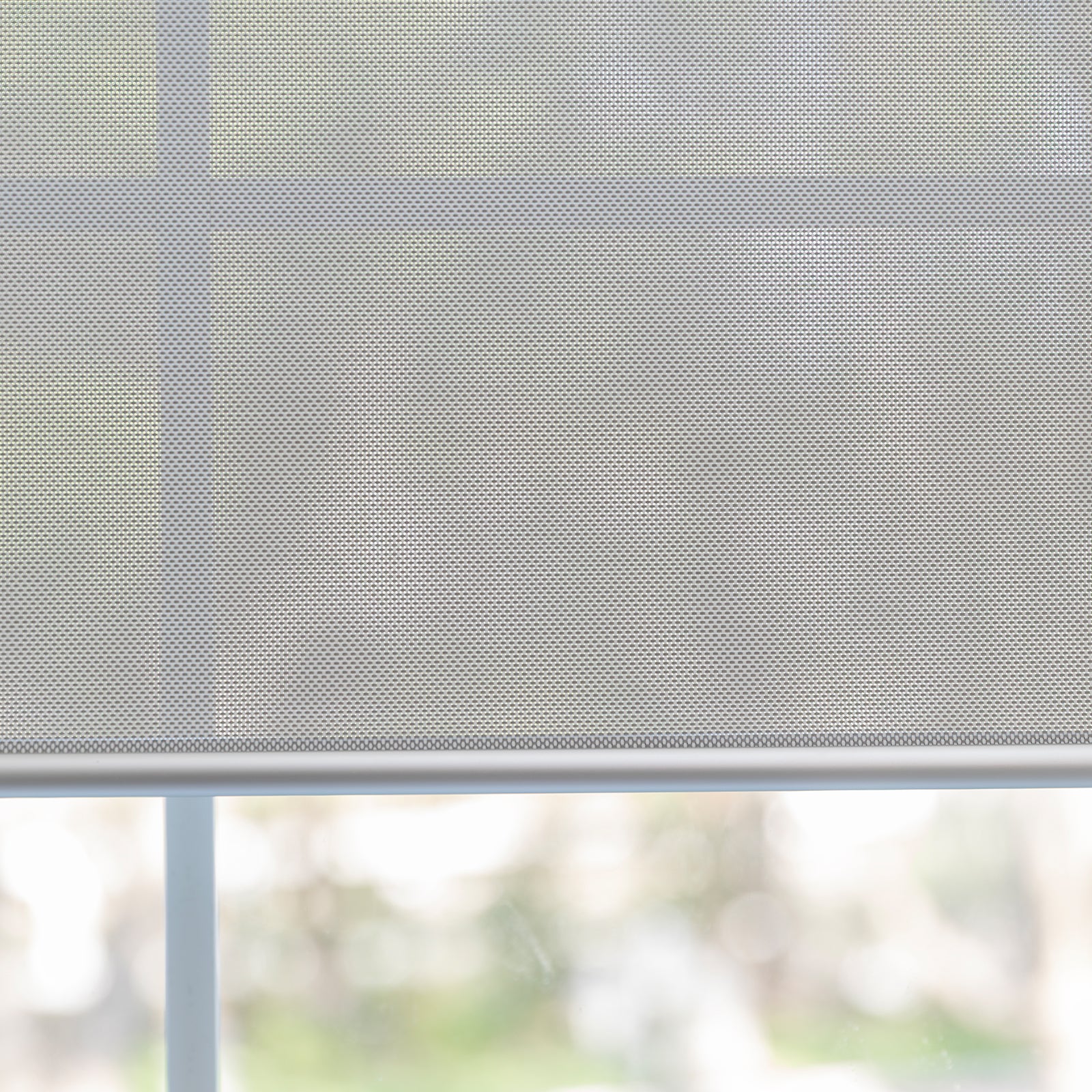 Joydeco Cove light filtering solar shade in light gray, semi-sheer woven fabric filtering sunlight for privacy.