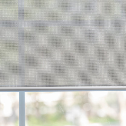 Joydeco Cove light filtering solar shade in light gray, semi-sheer woven fabric filtering sunlight for privacy.