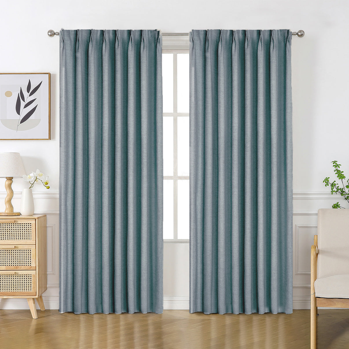 Custom blue-grey Flaxaline linen blackout curtains with textured weave in a modern living room.