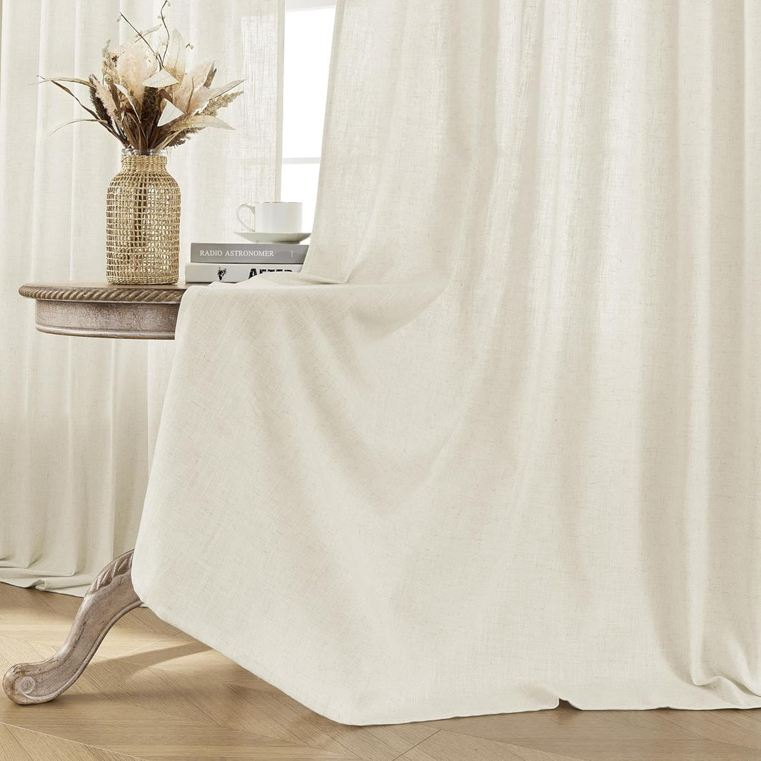 Joydeco off-white linen blend curtains close up, showing textured fabric weave and light filtering effect in a living room.