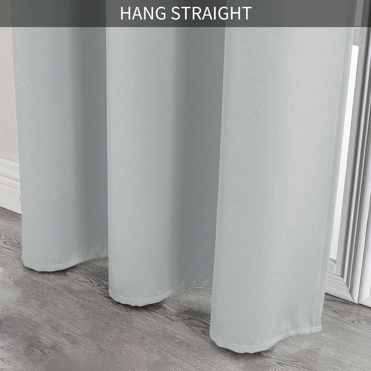 Light grey blackout curtain fabric close-up showcasing smooth texture and straight drape.