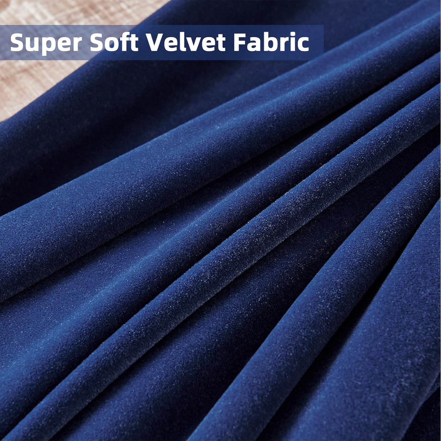Close up of deep blue velvet fabric texture, showing plush softness and elegant sheen of blackout curtains.