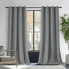 Joydeco Royal Blue velvet blackout curtains on a rod, framing a window with a house view. Thermal insulated for privacy.