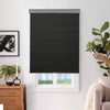 Joydeco black cordless cellular shades operated by remote control, with honeycomb texture, installed on a window.