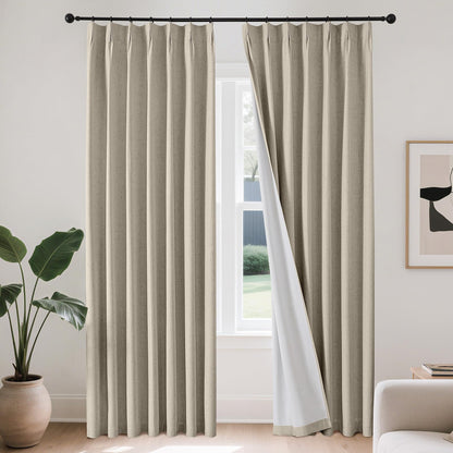 Joydeco beige linen blend pinch pleat blackout curtains with white lining on black rod.