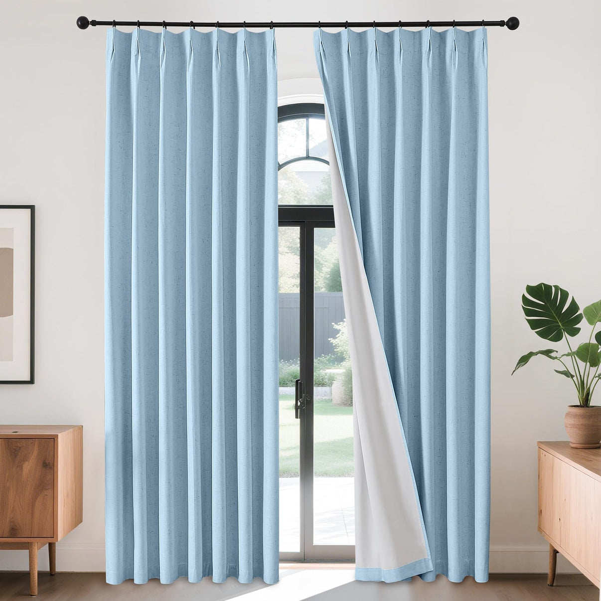 Joydeco light blue linen blackout curtains, pinch pleated thermal insulating drapes with white lining shown on black rod.
