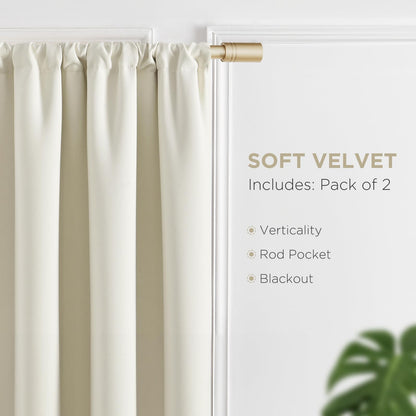 Cream velvet blackout curtain panel with rod pocket on gold rod. Pack of 2, thermal insulated drapes.