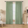 Sage green linen-look sheer curtains light filtering into a living room, shown on a black rod.