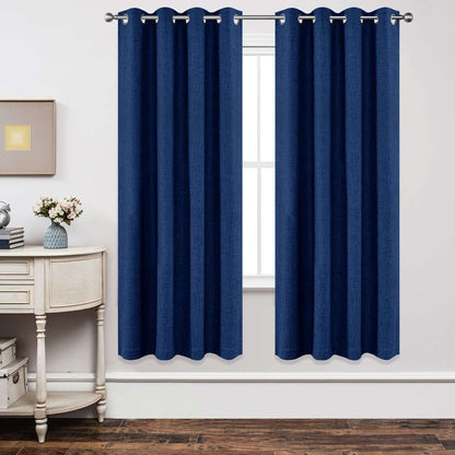 Navy blue linen blackout curtains hung on silver rod over white window, showcasing product.
