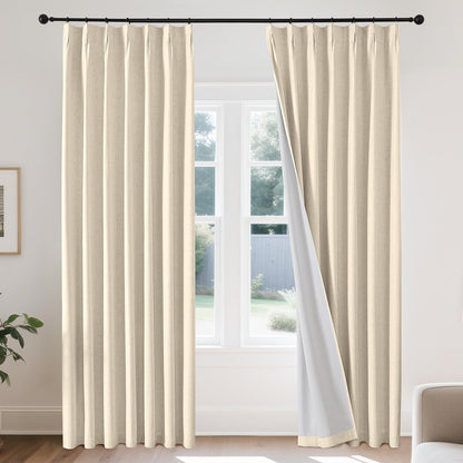 Joydeco beige linen blackout curtains pinch pleated thermal insulating drapes hanging on black rod.