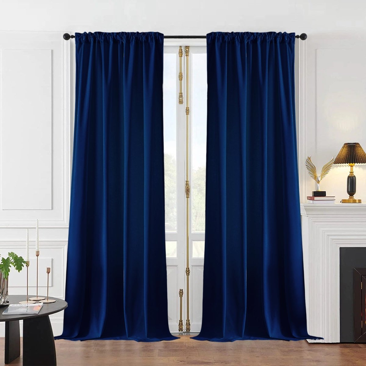 Deep blue velvet blackout curtains with rod pocket, showcasing luxurious texture in an elegant room setting.