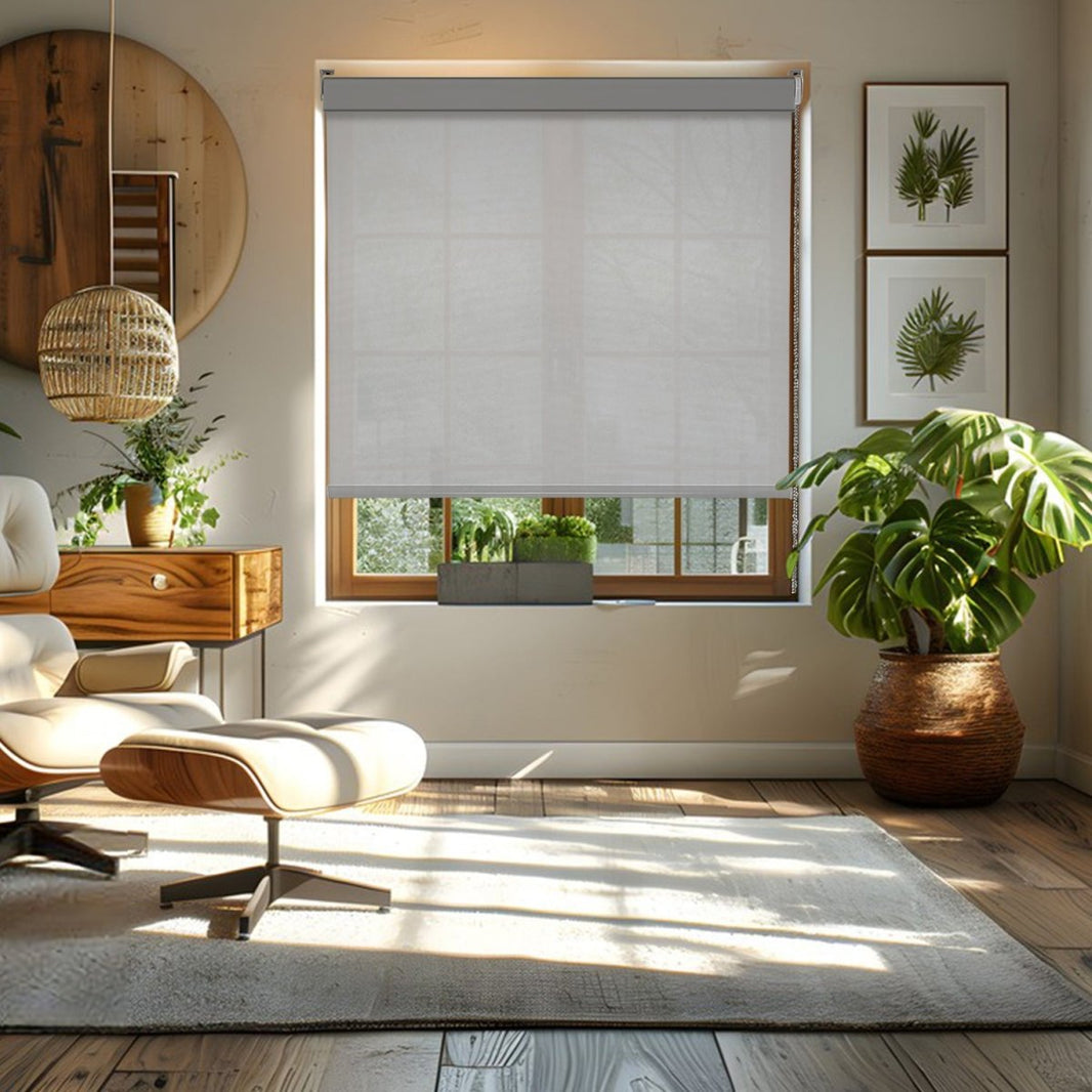 Joydeco white sheer weave solar shade installed on wooden window, filtering sunlight into living room with plants.