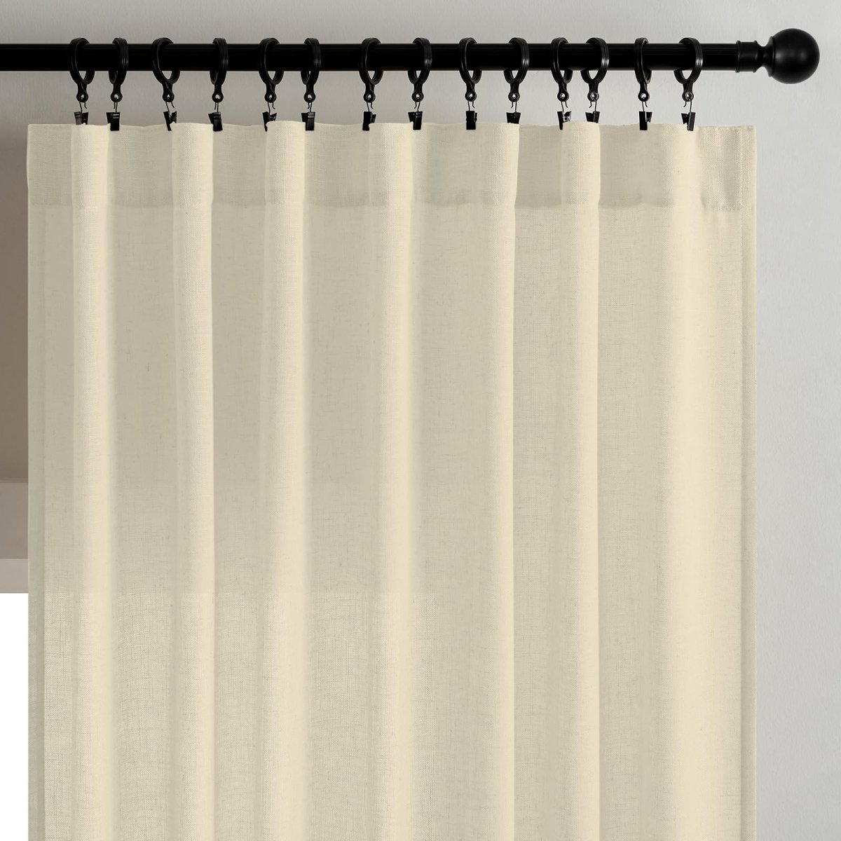 Joydeco light cream linen textured curtains on black rod, filtering light for semi-sheer living room privacy.