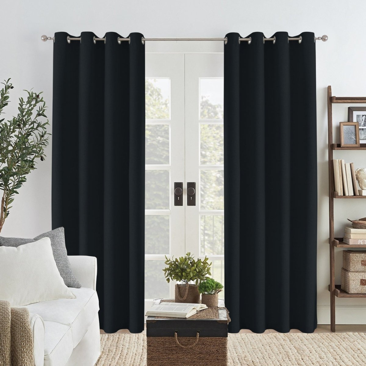 Black Joydeco custom linen blackout curtains with grommets hanging on a double door.