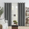 Dark grey Joydeco custom linen blackout curtains with grommets framing double doors in a living room.
