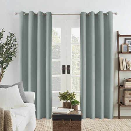 Sage green Joydeco linen blackout curtains with textured weave, framing double doors in a modern living room.