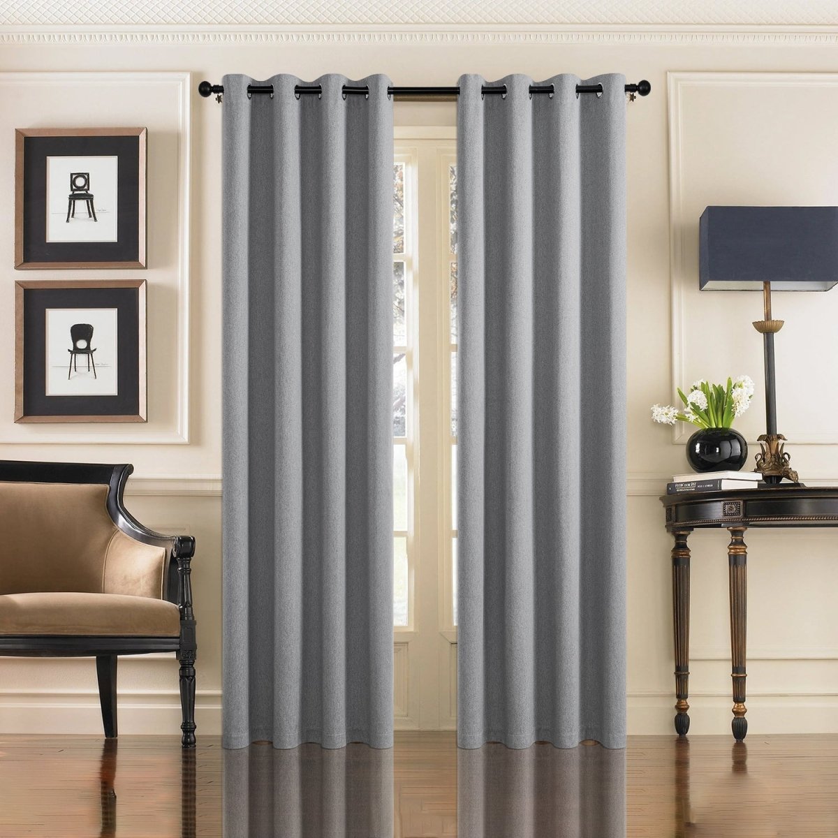 Two light gray Joydeco faux linen blackout curtains with grommet tops in a living room setting.