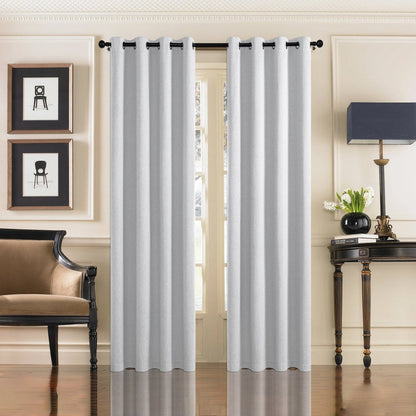 Light gray faux linen blackout curtains with grommets in a living room setting.