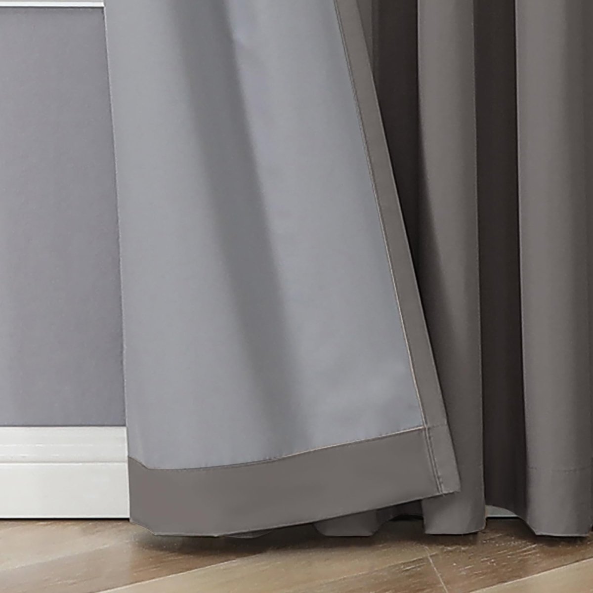 Close up of Joydeco grey blackout curtain panels showing smooth fabric texture and light blocking lining.
