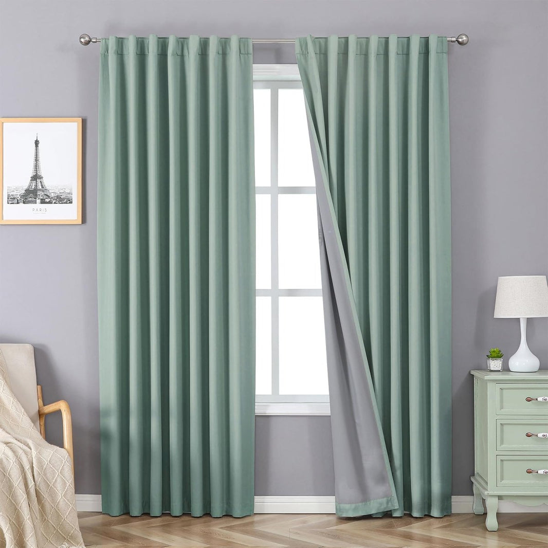 Joydeco Mineral Blue 100% blackout curtains, 2 panels shown with grey lining, rod pocket and back tab for bedroom windows.