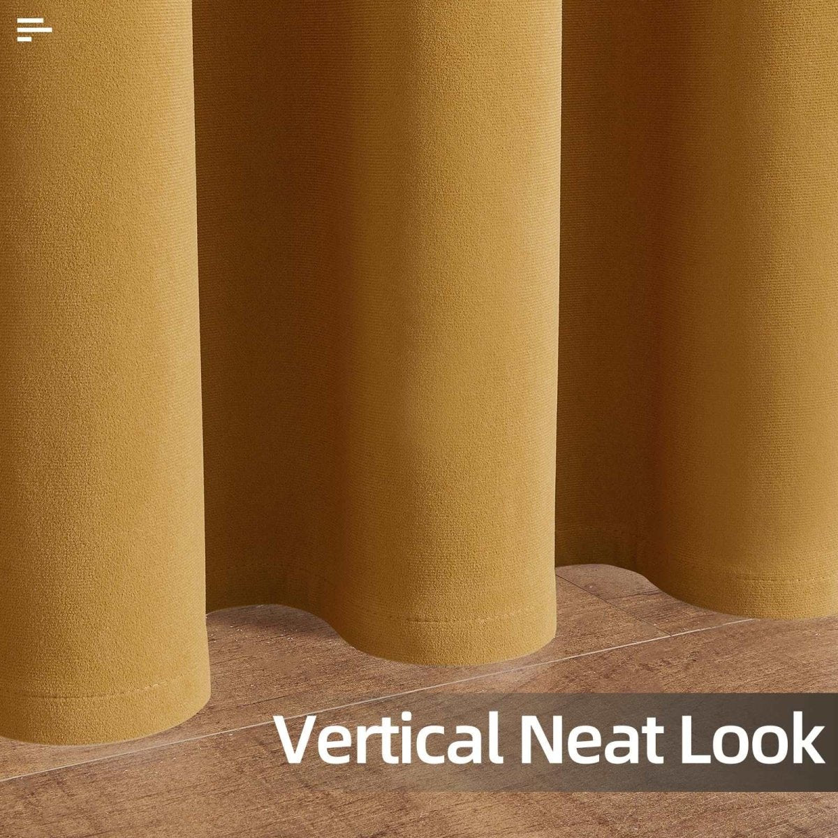Close-up of Joydeco mustard yellow velvet blackout curtains showing soft texture and neat vertical drape on wooden floor.
