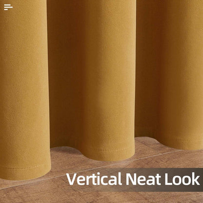 Close-up of Joydeco mustard yellow velvet blackout curtains showing soft texture and neat vertical drape on wooden floor.