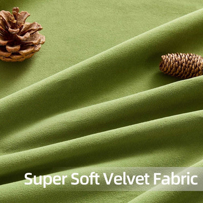 Close-up of olive green velvet blackout curtain fabric, plush texture, with pinecones, showcasing material quality.