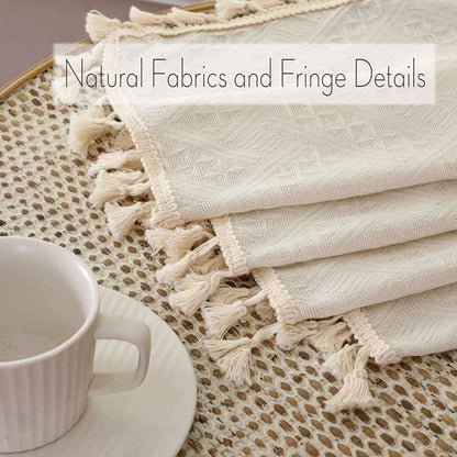 Close-up of Joydeco beige boho linen curtains showcasing diamond weave texture and cream tassels on folded edges.