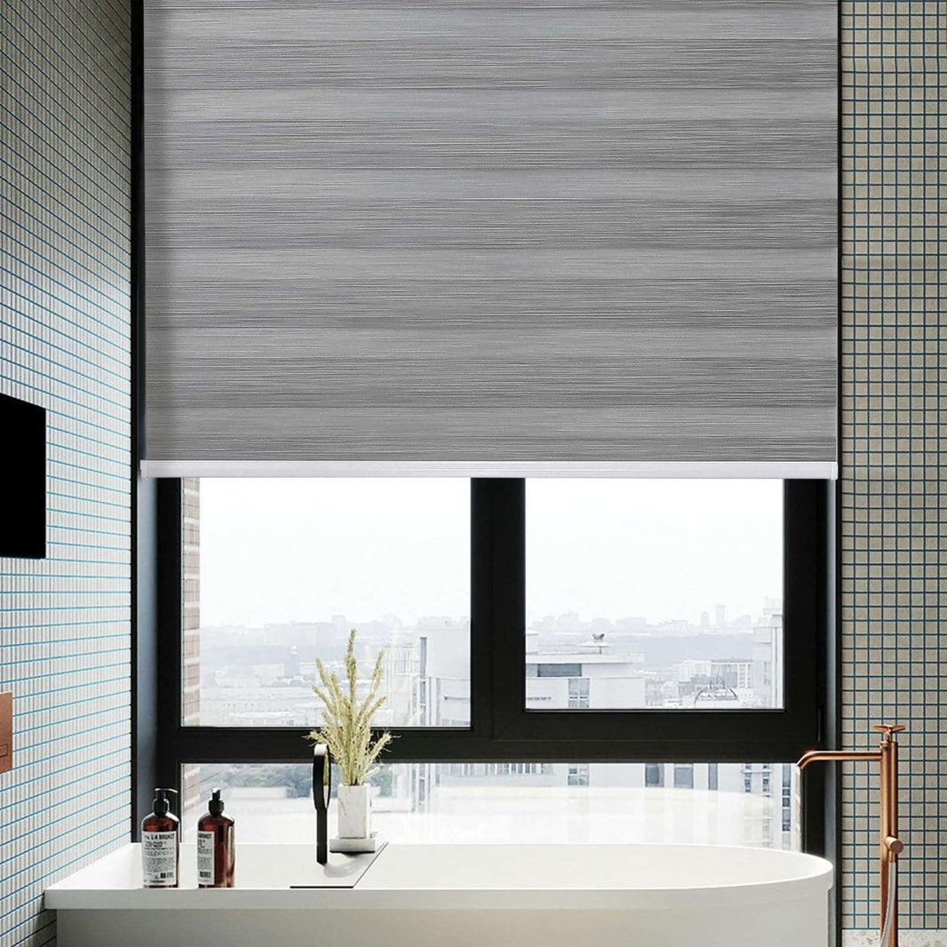 Joydeco grey cordless zebra roller shades installed on bathroom window, offering dual-layer light filtering and privacy.