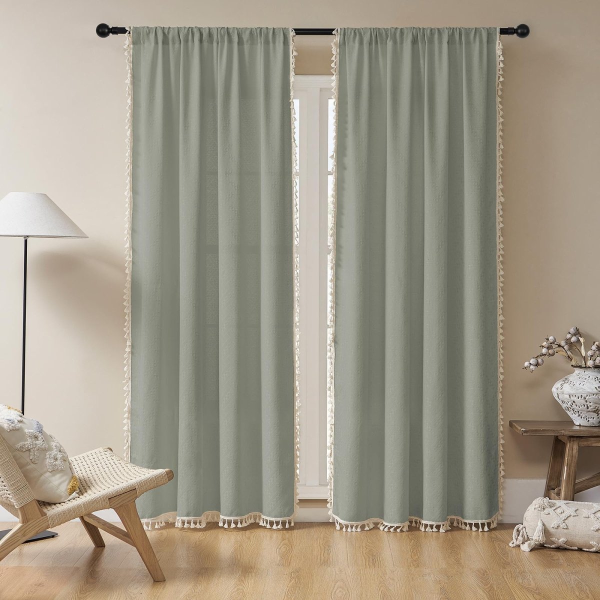 Two sage green boho linen sheer curtains with tassel trim, light filtering, farmhouse style for living room.