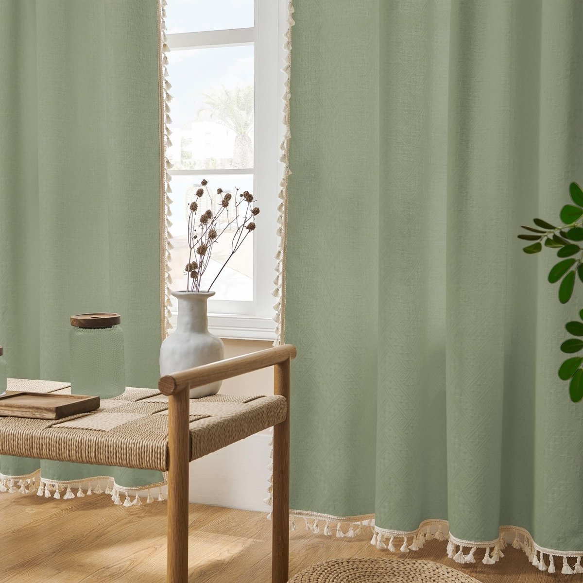 Sage green linen curtains with cream tassels, light filtering, boho farmhouse style decor.