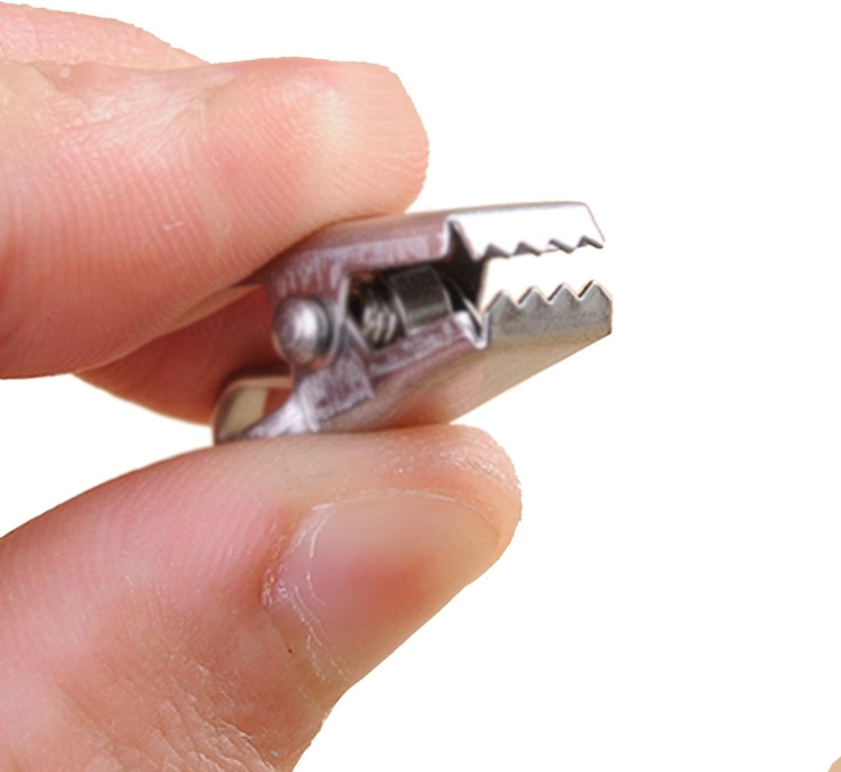Joydeco small stainless steel clip with serrated grip and spring, shown by fingers for scale.