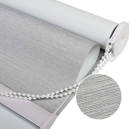Close-up of Joydeco light grey roller shade with 100% blackout Striped Jacquard fabric texture and white beaded chain.