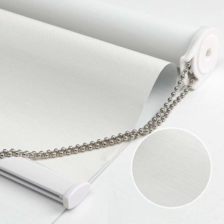 White 100% blackout roller shade with subtly textured fabric, metal pull chain, and close-up fabric detail inset.