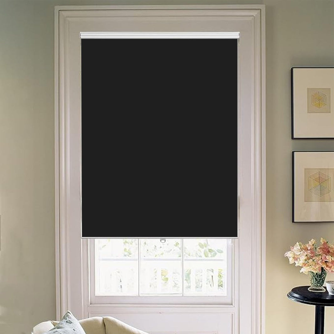 Joydeco Black Cordless Blackout Roller Shade with Aluminum Bottom Rod in White Trimmed Window.