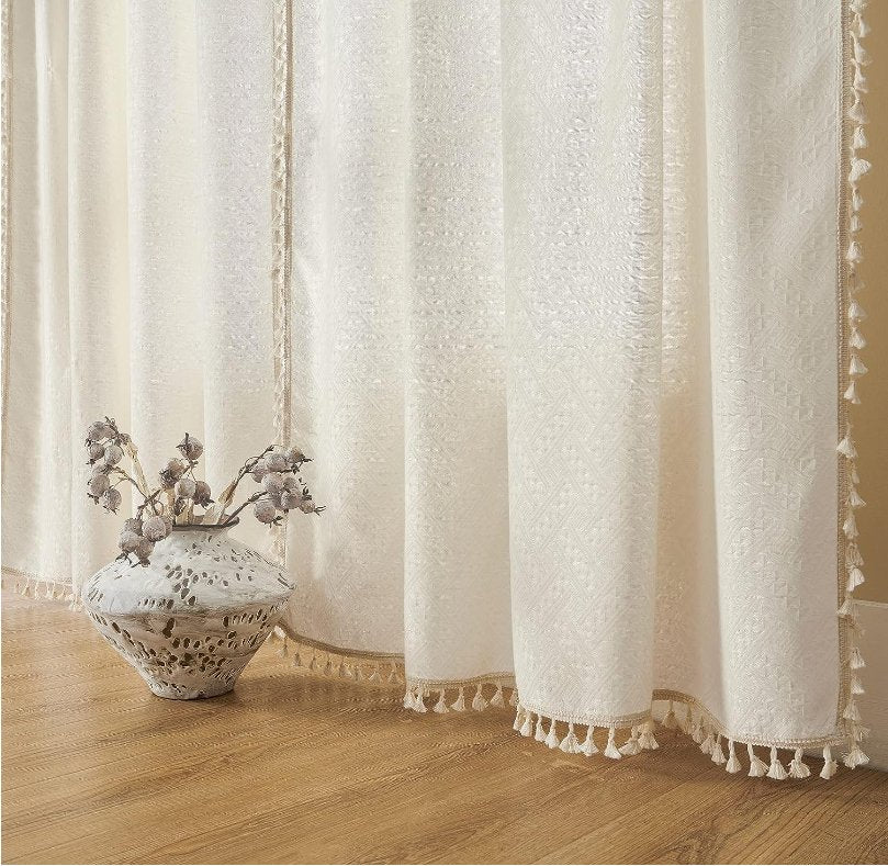 Joydeco cream boho curtains with textured pattern and tassels, 108 inches long, light filtering.