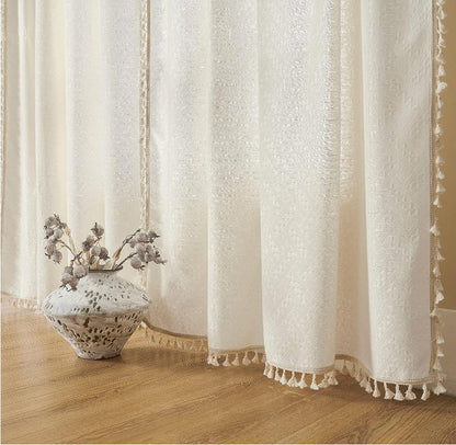 Joydeco cream boho curtains with textured pattern and tassels, 108 inches long, light filtering.