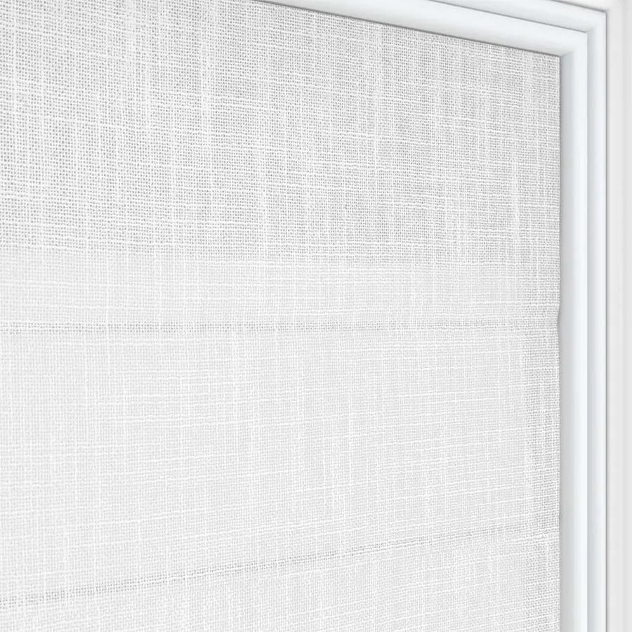 Close up of Joydeco white linen blend Roman shade texture with horizontal folds filtering light.