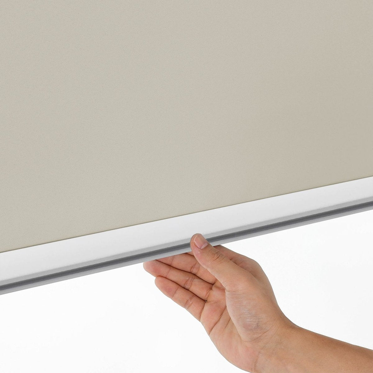 Joydeco light beige cordless blackout roller shade operation with aluminum bottom rod.