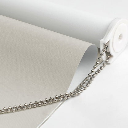 Joydeco light grey jacquard blackout roller shade fabric close-up, showing texture, white backing, chain, and bracket.