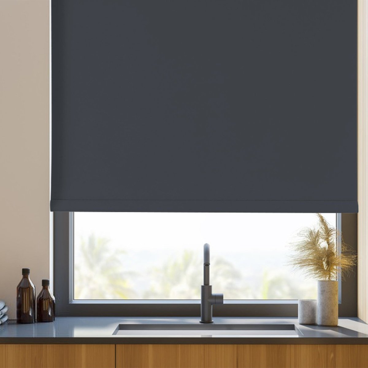 Joydeco dark gray cordless blackout roller shade on kitchen window above sink, modern design with aluminum bottom rod.