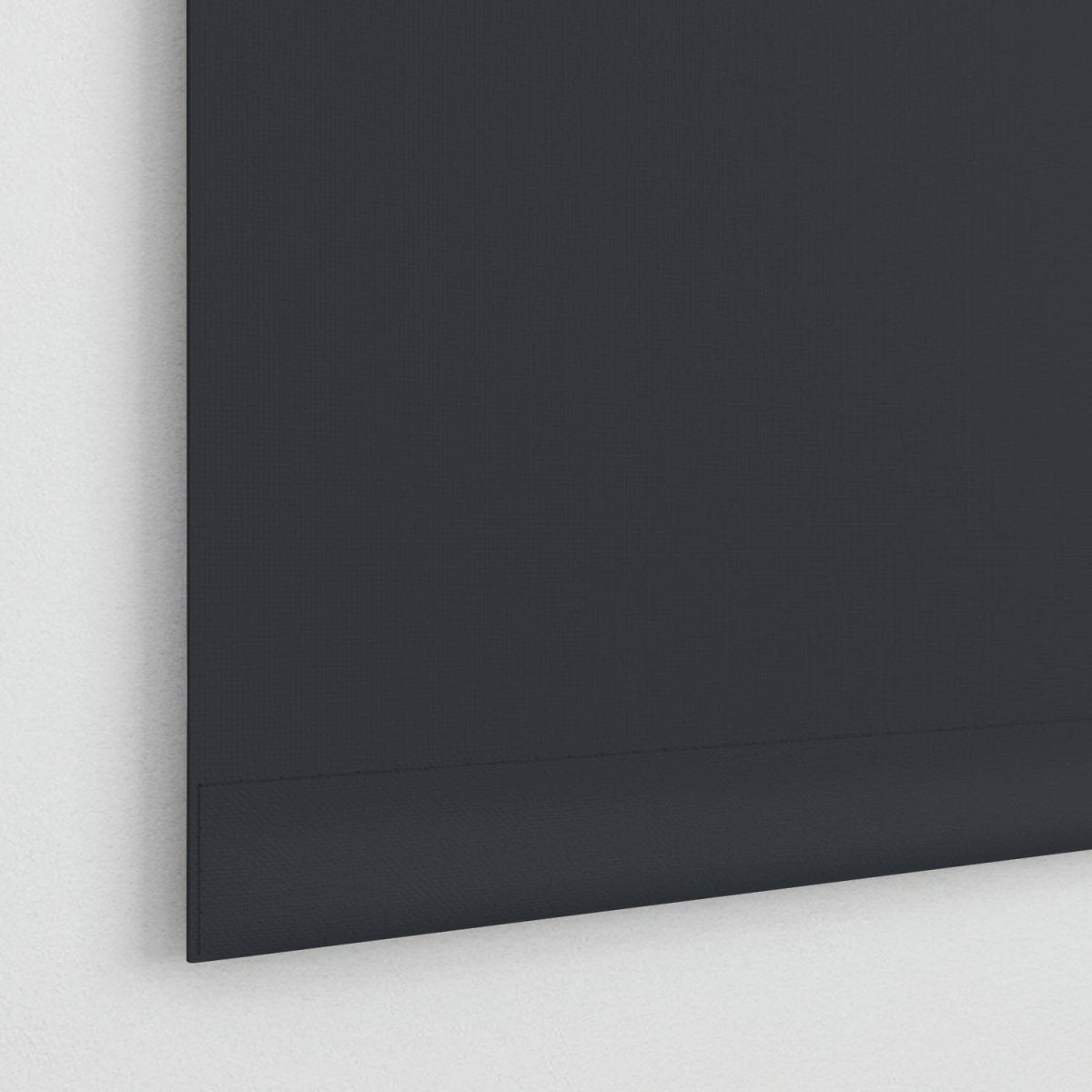 Joydeco dark gray striped jacquard blackout roller shade fabric detail with clean aluminum bottom rod on white wall.