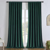 Hunter green linen blackout curtains hanging on a black rod, offering energy efficiency and privacy for any room.