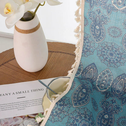 Joydeco blue bohemian curtains with intricate paisley design and cream tassel trim, close-up fabric detail.