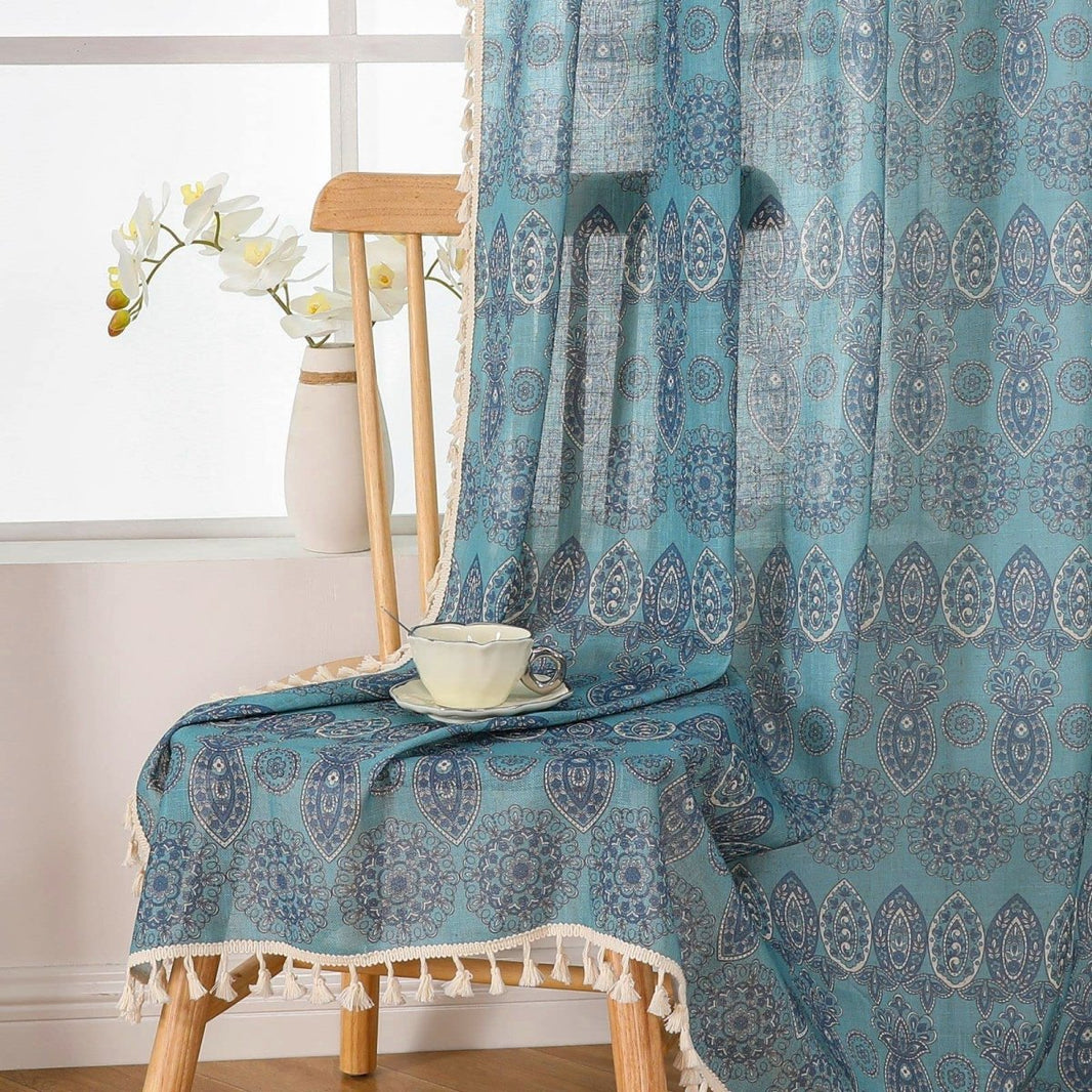 Joydeco bohemian blue patterned curtains with medallion and paisley print, featuring cream tassel trim for living room.