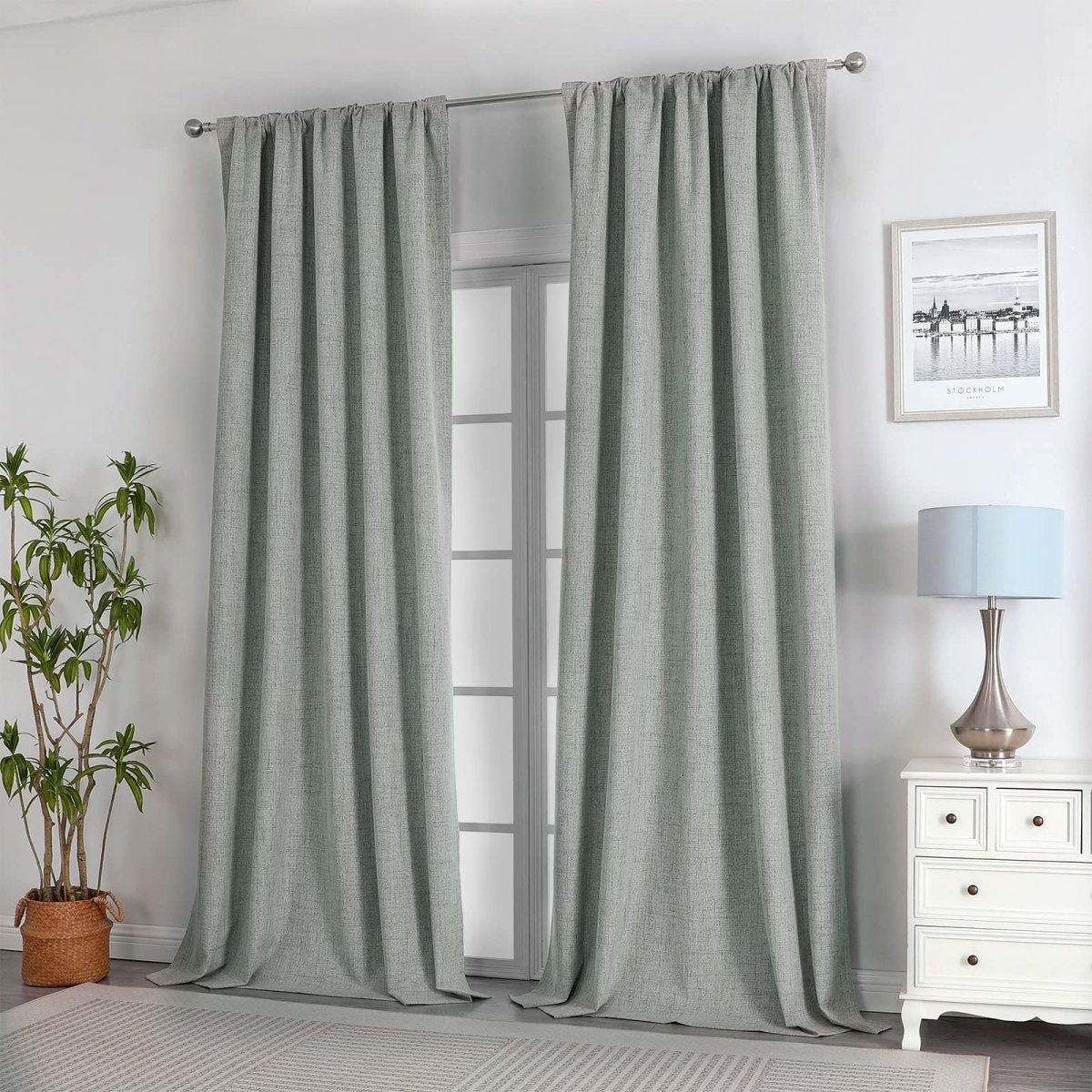 Sage green linen blend blackout curtains on rod, French doors, living room setting.