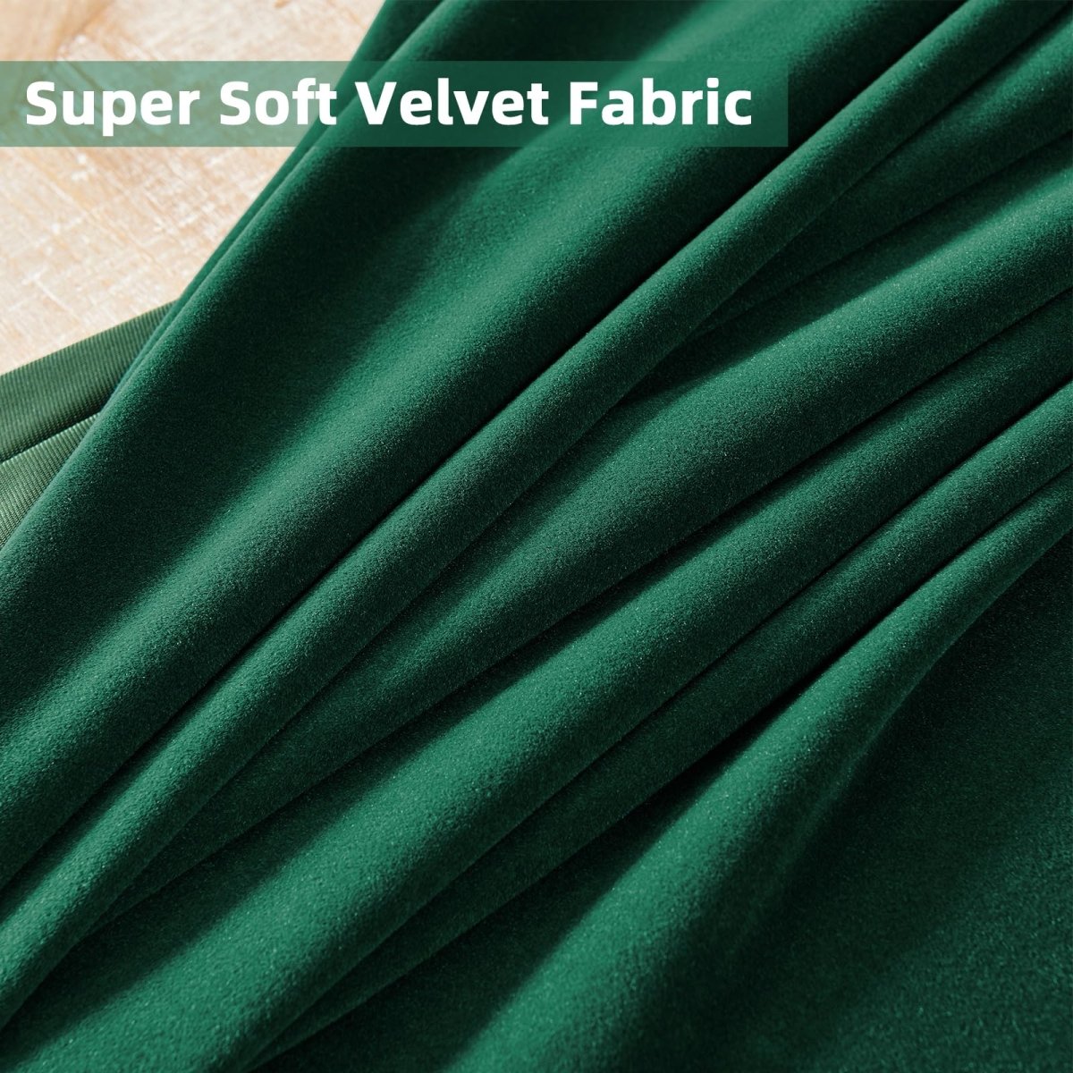 Close-up emerald green velvet fabric, showcasing Joydeco luxury curtains' super soft, plush texture and quality.